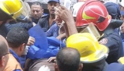 إنقاذ أحد أفراد الحماية المدنية من أسفل مصنع المحلة المنهار
